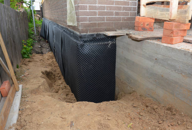 SJ Waterproofing Pros technician performing targeted Crawl Space Encapsulation assessment in Hales Corners, WI